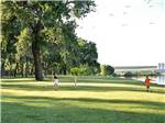 View larger image of A couple of kids playing on the grass at SOUTH DAKOTA DEPT OF GAME FISH  PARKS image #7