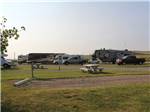 An empty gravel campsite with a picnic table at TRAILS WEST RV PARK - thumbnail