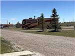 One of the gravel roads going to the RV sites at TRAILS WEST RV PARK - thumbnail