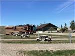 A row of gravel RV sites at TRAILS WEST RV PARK - thumbnail