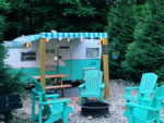 Vintage trailers and matching chairs at Camp Leconte Luxury Outdoor Resort - thumbnail