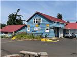 Exterior of the blue office with red roof - thumbnail
