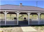 A white wooden pavilion at SHELBY RV PARK AND RESORT - thumbnail