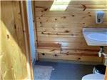 A wooden walled bathroom at SHELBY RV PARK AND RESORT - thumbnail