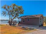 A rental cabin with a lake view at Hidden Cove Park - thumbnail