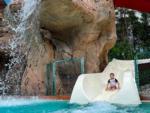 View larger image of A boy coming down the waterslide at MOOSE HILLOCK CAMPING RESORT NY image #8