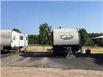 A fifth wheel trailer in a back in site at NORTH POINT RV PARK - thumbnail
