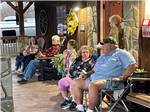 A group of people sitting at the front office at GREYSTONE RV PARK - thumbnail