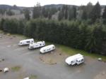 Parked travel trailer with woods in the background at Quileute Riverview RV Park - thumbnail