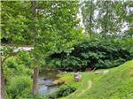 Sitting area on the water at Valley River RV Resort - thumbnail