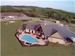 View larger image of Aerial view of campground pool at BY THE LAKE RV PARK RESORT image #1