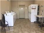 Laundry room with washer and dryers at BY THE LAKE RV PARK - thumbnail
