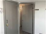 A gray door leading to the restroom at GREEN RIVER RV PARK - thumbnail