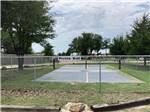 The fenced in pickle ball court at LITTLE TURTLE RV & STORAGE - thumbnail