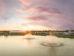 RV sites near a pond at sunset - thumbnail