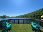 Lake view with chairs at LAKE COMPOUNCE CAMPGROUND - thumbnail