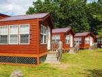 A row of rental cabins at LAKE COMPOUNCE CAMPGROUND - thumbnail