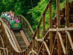 People on roller coaster ride nearby at LAKE COMPOUNCE CAMPGROUND - thumbnail