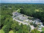 Aerial shot of RV park surrounded by forested landscape at SWEETWATER CREEK RV RESERVE - thumbnail