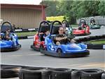 View larger image of People driving around on go carts at CRYSTAL LAKE RV PARK image #8