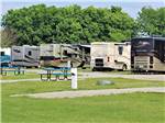 View larger image of Picnic tables next to gravel RV sites at CRYSTAL LAKE RV PARK image #10