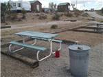 A picnic table and trash can at MEADVIEW RV PARK & COZY CABINS - thumbnail