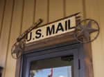 A US Mail sign above a door - thumbnail