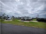 View larger image of Several of the campsites with campers at ALLIANCE HILL RV RESORT image #4