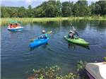 View larger image of Boaters on the lake at QUAIL CREEK RV RESORT image #6