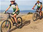 Two people mountain biking at WILD GOOSE MEADOWS RV PARK - thumbnail