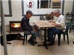 Two men putting a puzzle together at WILD GOOSE MEADOWS RV PARK - thumbnail