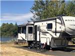 A fifth wheel trailer in a paved RV site at FRIENDS LANDING RV PARK - thumbnail