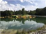 View larger image of The inflatable play equipment on the lake at LAUREL LAKE CAMPING RESORT image #1