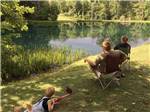 View larger image of A family fishing in the lake at LAUREL LAKE CAMPING RESORT image #4