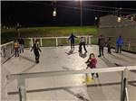 View larger image of Families enjoying the ice skating rink at LAUREL LAKE CAMPING RESORT image #10