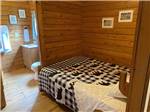 View larger image of Bedroom and bathroom of private cabin at COBBLE HILL CAMPGROUND image #11