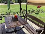 Picnic table near bicycles at ROLLINS RV PARK & RESTAURANT - thumbnail