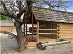 One of the rustic rental log cabins at CHOTEAU MOUNTAIN VIEW RV CAMPGROUND - thumbnail