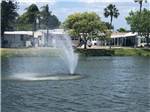 View larger image of The fountain in the pond at HOLIDAY TRAVEL PARK image #5