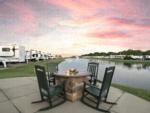 Community firepit, RVs by the water at Highway 6 RV Resort - thumbnail