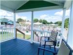 View larger image of A covered patio overlooking the pool at SWAN BAY RESORT image #12