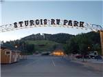 View larger image of Entrance with sign over the road at STURGIS RV PARK image #1