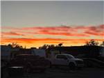A group of RVs sited at dusk at WORLAND RV PARK AND CAMPGROUND - thumbnail