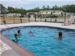 View larger image of Kids playing in the pool at GRAND TEXAS RV RESORT image #1