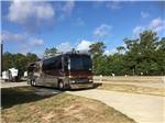 View larger image of A bus conversion in a long pull thru site at GRAND TEXAS RV RESORT image #6