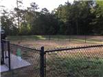 View larger image of The fenced in pet area at GRAND TEXAS RV RESORT image #9