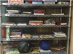 Metal shelves full of books at CONCHO PEARL RV ESTATES - thumbnail