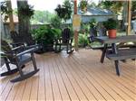 Covered area with Rocking Chairs at All About Relaxing RV Park - thumbnail