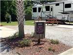 Personalized welcome sign at a gravel site at All About Relaxing RV Park - thumbnail