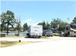 View larger image of A group of RV sites by the water at TYLER OAKS RV RESORT image #9